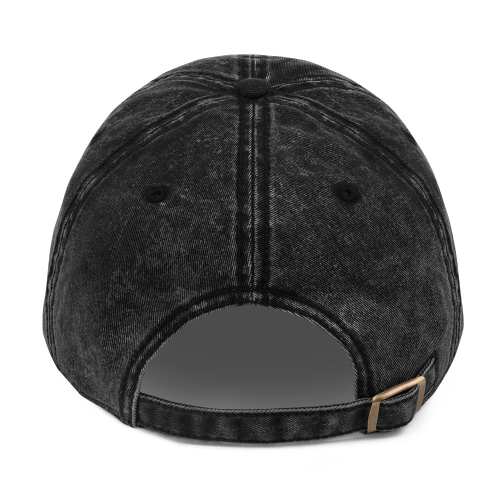 Back view of the embroidered "We Are Not For Sale" cotton twill black stone-washed cap